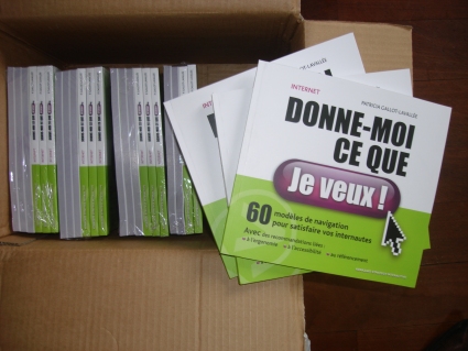 Pleins de livres 'Internet, donne-moi ce que je veux encore' dans leur carton